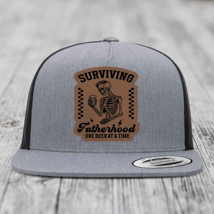 Surviving Fatherhood, One Beer At A Time - Leather Patch Hat - Dark Brown to Black Patch - Yupoong 6006 Snapback Flatbill Hat