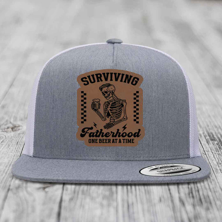 Surviving Fatherhood, One Beer At A Time - Leather Patch Hat - Dark Brown to Black Patch - Yupoong 6006 Snapback Flatbill Hat