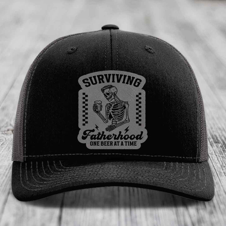 Surviving Fatherhood, One Beer At A Time - Leather Patch Hat - Grey to Black Patch - Richardson 112 Snapback Trucker Hat