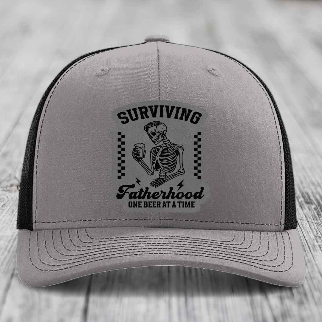 Surviving Fatherhood, One Beer At A Time - Leather Patch Hat - Grey to Black Patch - Richardson 112 Snapback Trucker Hat