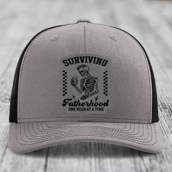 Surviving Fatherhood, One Beer At A Time - Leather Patch Hat - Grey to Black Patch - Richardson 112 Snapback Trucker Hat