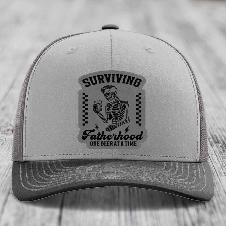 Surviving Fatherhood, One Beer At A Time - Leather Patch Hat - Grey to Black Patch - Richardson 112 Snapback Trucker Hat
