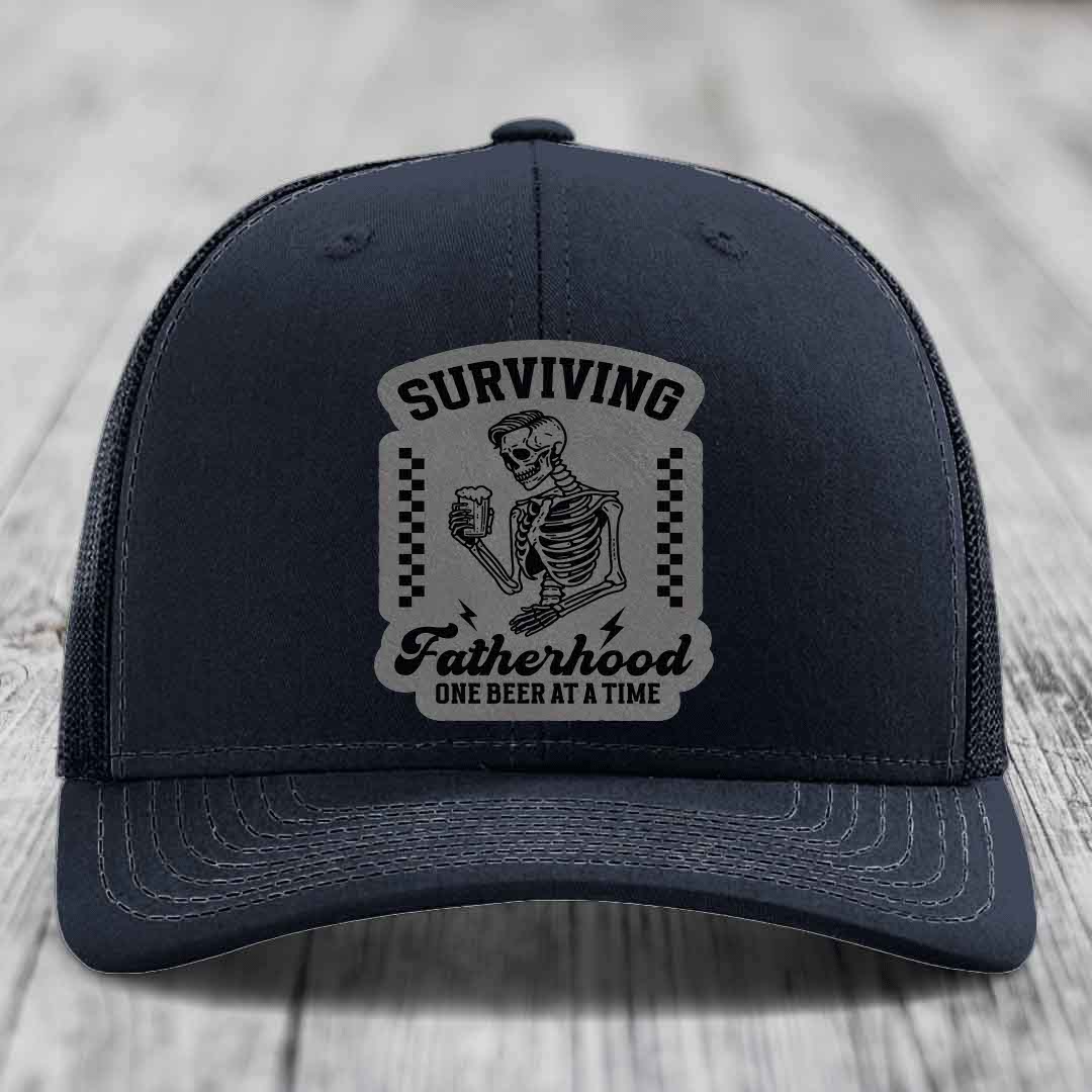Surviving Fatherhood, One Beer At A Time - Leather Patch Hat - Grey to Black Patch - Richardson 112 Snapback Trucker Hat