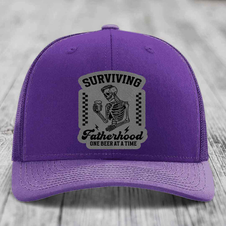 Surviving Fatherhood, One Beer At A Time - Leather Patch Hat - Grey to Black Patch - Richardson 112 Snapback Trucker Hat