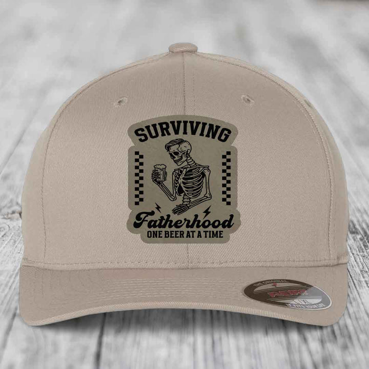 Surviving Fatherhood, One Beer At A Time - Leather Patch Hat - Light Brown to Black Patch - Flexfit 6277 Fitted Hat