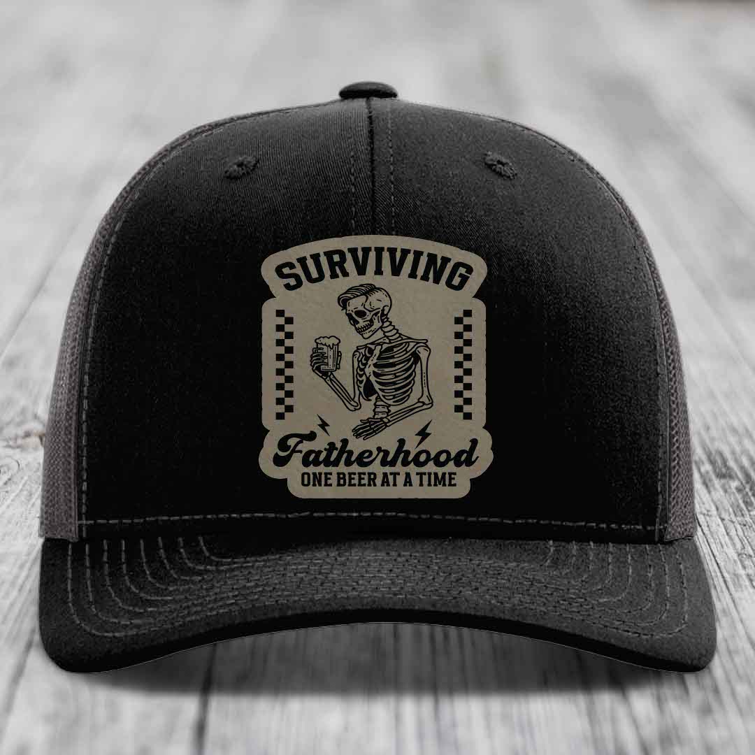 Surviving Fatherhood, One Beer At A Time - Leather Patch Hat - Light Brown to Black Patch - Richardson 112 Snapback Trucker Hat