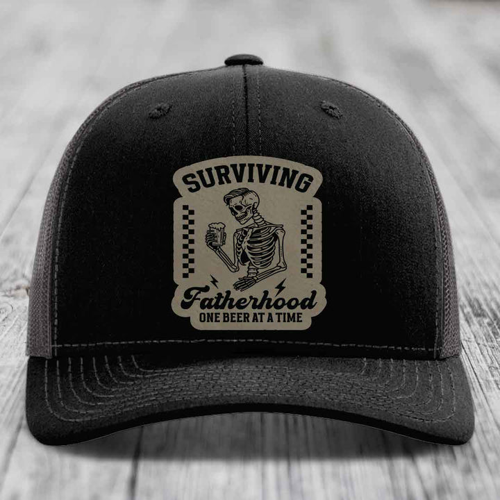 Surviving Fatherhood, One Beer At A Time - Leather Patch Hat - Light Brown to Black Patch - Richardson 112 Snapback Trucker Hat