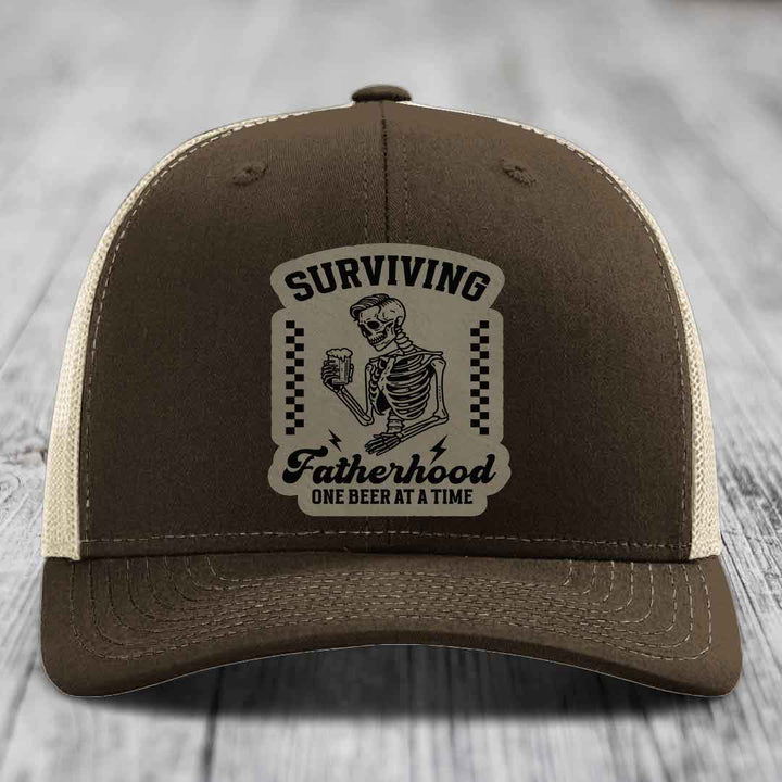 Surviving Fatherhood, One Beer At A Time - Leather Patch Hat - Light Brown to Black Patch - Richardson 112 Snapback Trucker Hat