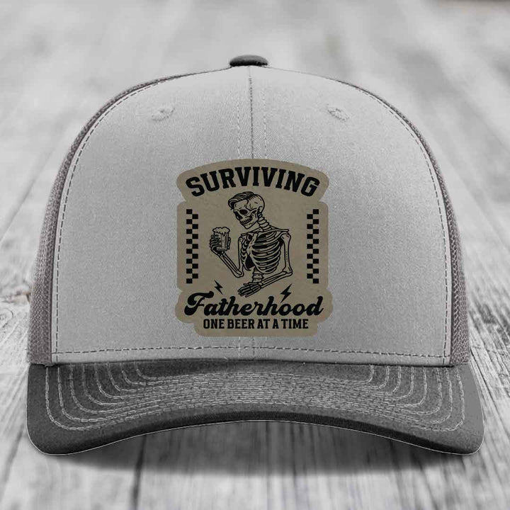 Surviving Fatherhood, One Beer At A Time - Leather Patch Hat - Light Brown to Black Patch - Richardson 112 Snapback Trucker Hat