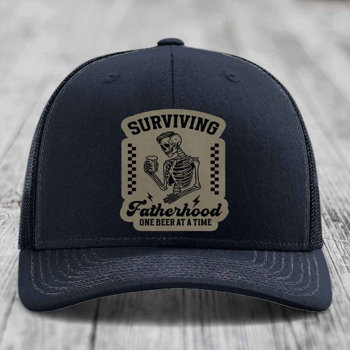 Surviving Fatherhood, One Beer At A Time - Leather Patch Hat - Light Brown to Black Patch - Richardson 112 Snapback Trucker Hat