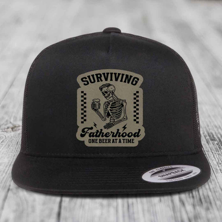 Surviving Fatherhood, One Beer At A Time - Leather Patch Hat - Light Brown to Black Patch - Yupoong 6006 Snapback Flatbill Hat