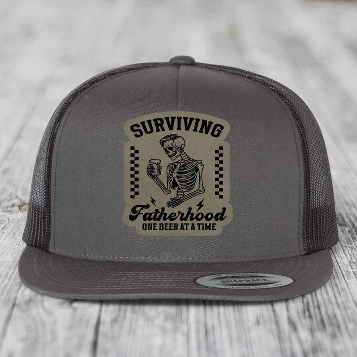 Surviving Fatherhood, One Beer At A Time - Leather Patch Hat - Light Brown to Black Patch - Yupoong 6006 Snapback Flatbill Hat