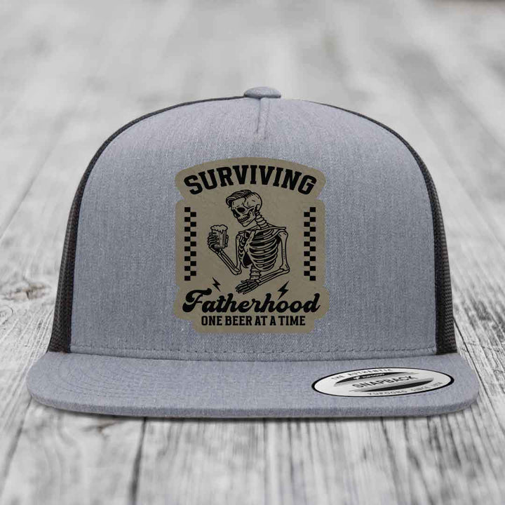 Surviving Fatherhood, One Beer At A Time - Leather Patch Hat - Light Brown to Black Patch - Yupoong 6006 Snapback Flatbill Hat
