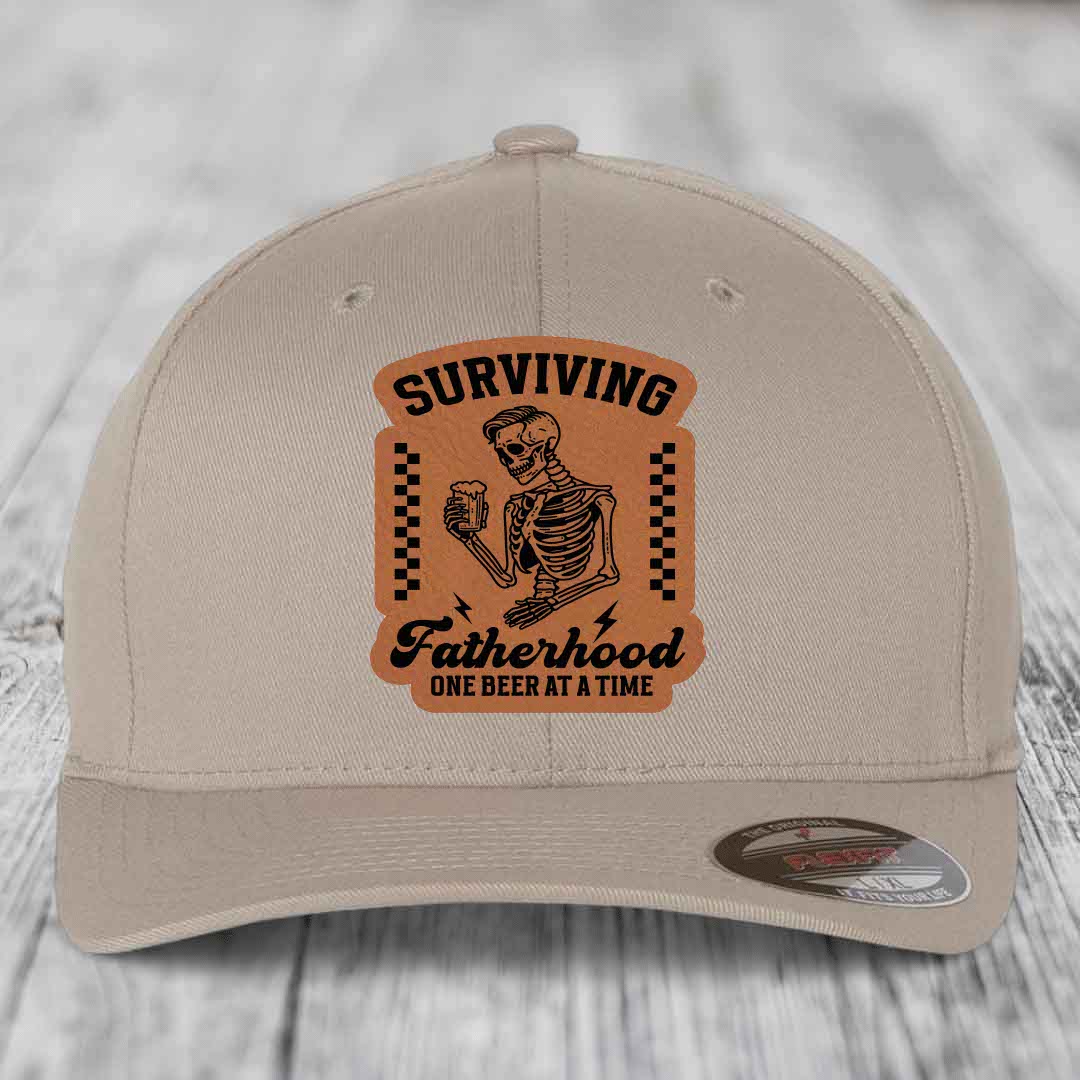 Surviving Fatherhood, One Beer At A Time - Leather Patch Hat - Rawhide to Black Patch - Flexfit 6277 Fitted Hat