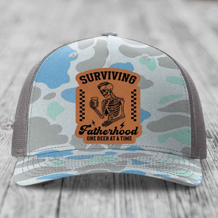 Surviving Fatherhood, One Beer At A Time - Leather Patch Hat - Rawhide to Black Patch - Richardson 112PFP Snapback Trucker Hat