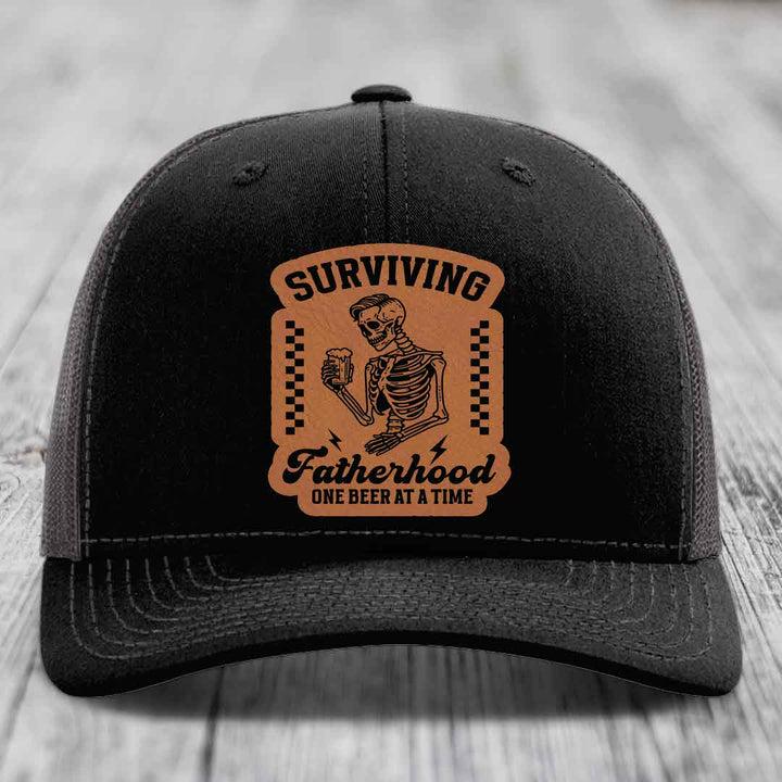 Surviving Fatherhood, One Beer At A Time - Leather Patch Hat - Rawhide to Black Patch - Richardson 112 Snapback Trucker Hat