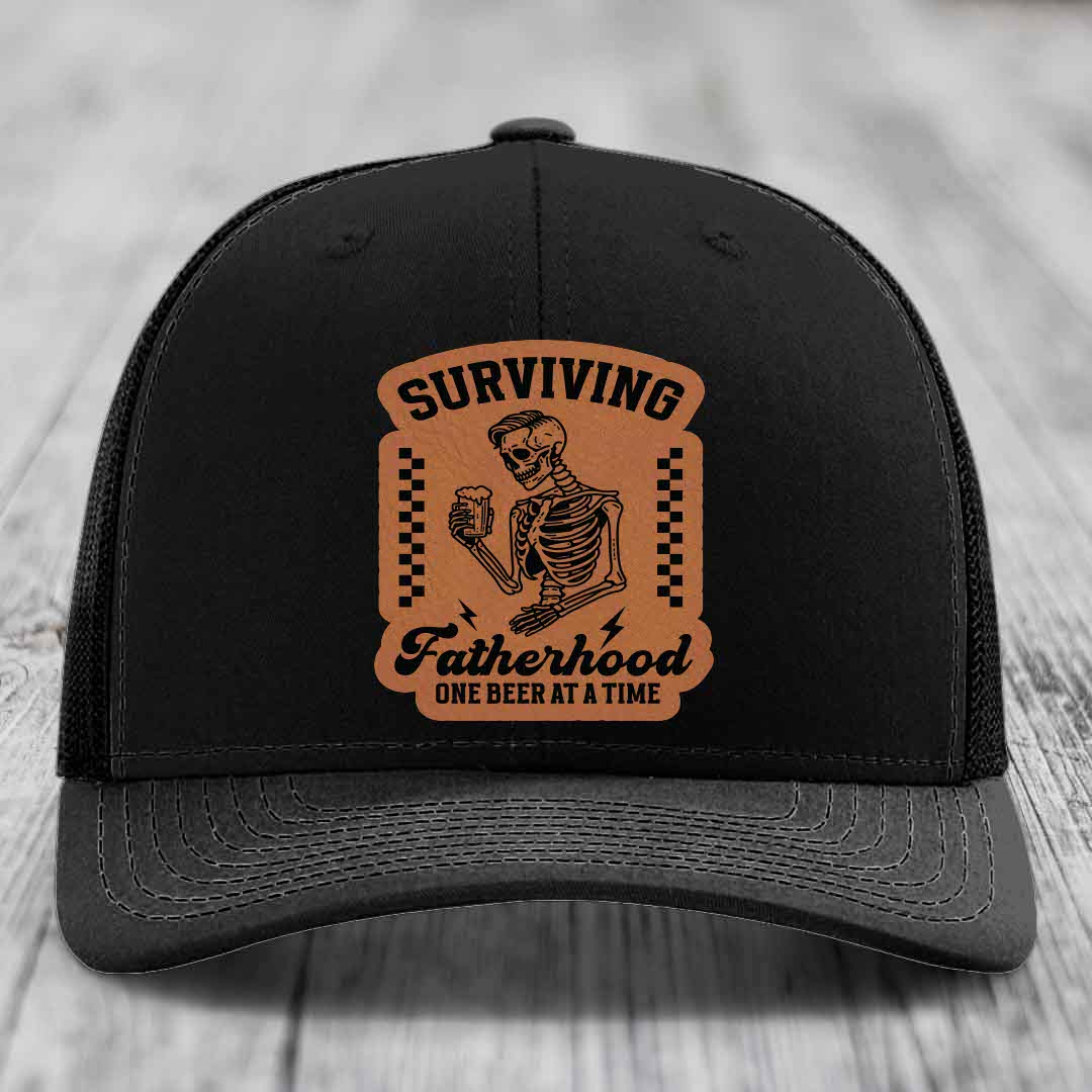 Surviving Fatherhood, One Beer At A Time - Leather Patch Hat - Rawhide to Black Patch - Richardson 112 Snapback Trucker Hat