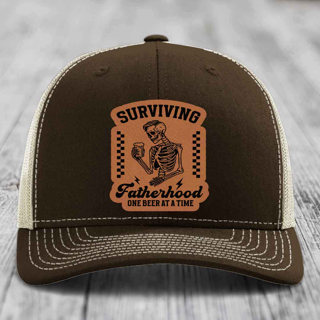 Surviving Fatherhood, One Beer At A Time - Leather Patch Hat - Rawhide to Black Patch - Richardson 112 Snapback Trucker Hat