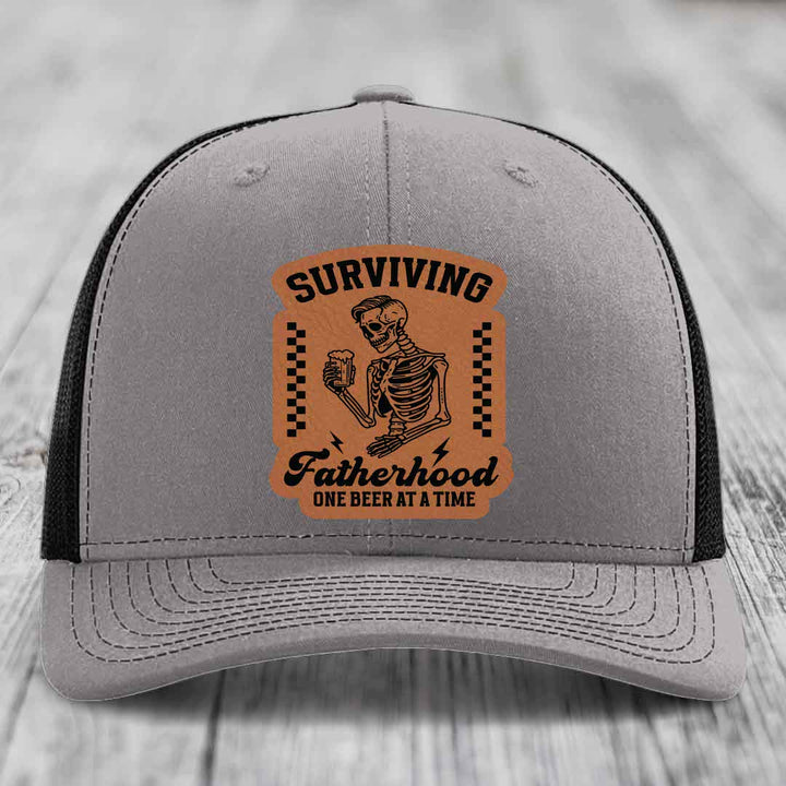 Surviving Fatherhood, One Beer At A Time - Leather Patch Hat - Rawhide to Black Patch - Richardson 112 Snapback Trucker Hat