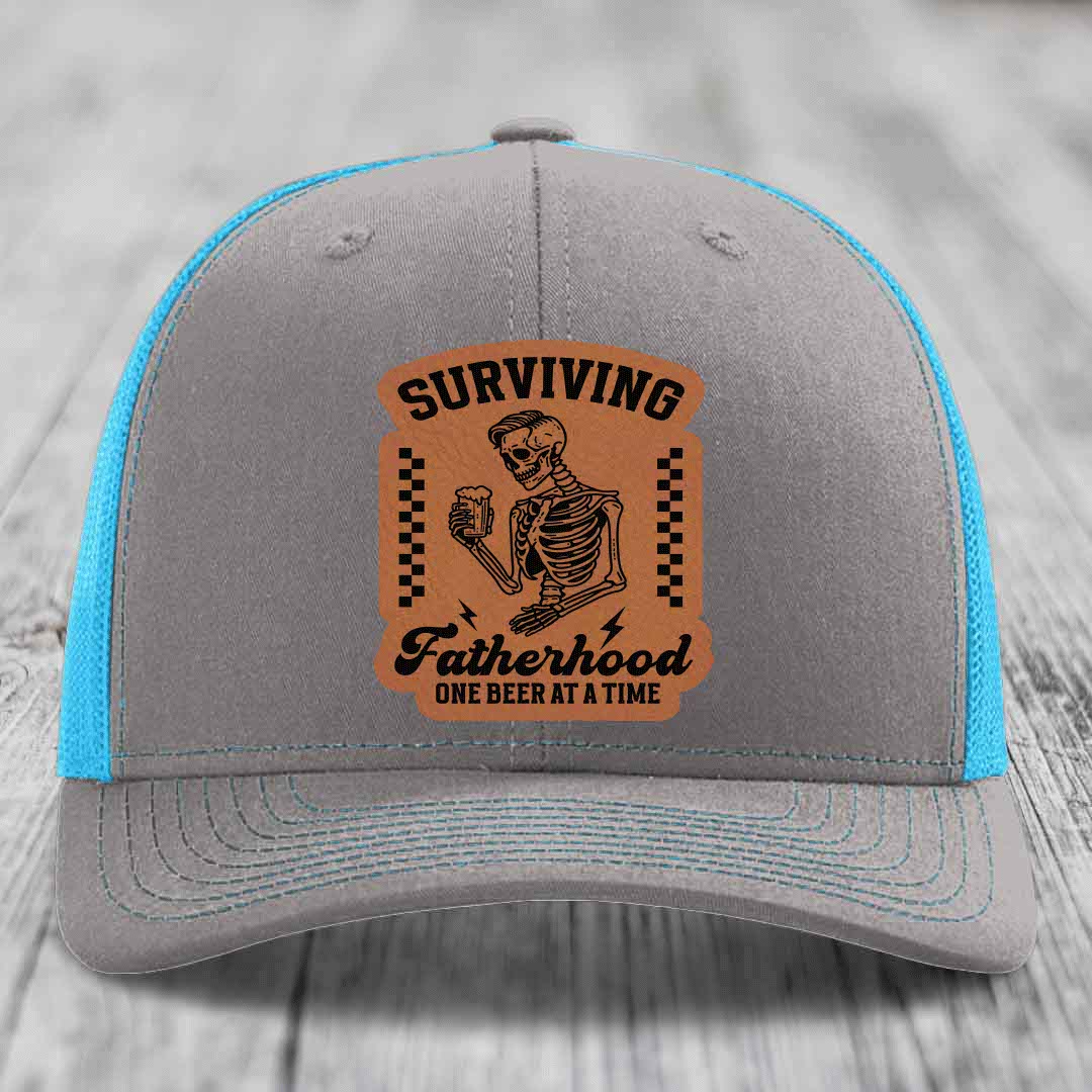 Surviving Fatherhood, One Beer At A Time - Leather Patch Hat - Rawhide to Black Patch - Richardson 112 Snapback Trucker Hat
