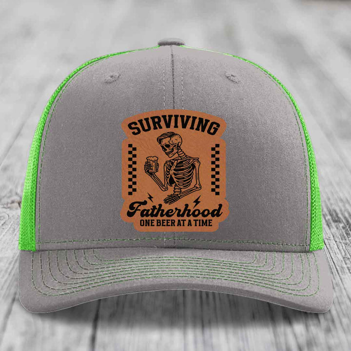Surviving Fatherhood, One Beer At A Time - Leather Patch Hat - Rawhide to Black Patch - Richardson 112 Snapback Trucker Hat