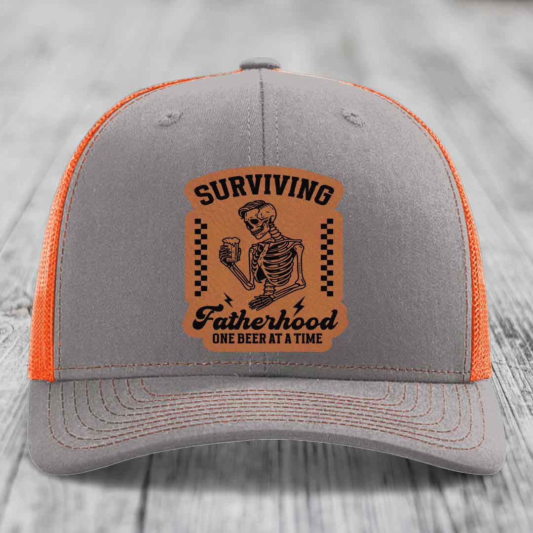 Surviving Fatherhood, One Beer At A Time - Leather Patch Hat - Rawhide to Black Patch - Richardson 112 Snapback Trucker Hat