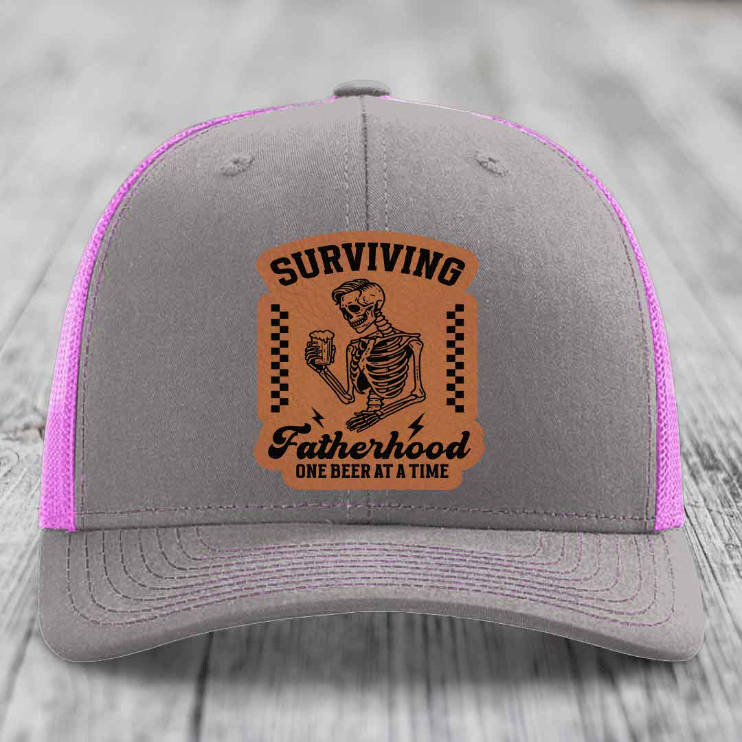 Surviving Fatherhood, One Beer At A Time - Leather Patch Hat - Rawhide to Black Patch - Richardson 112 Snapback Trucker Hat