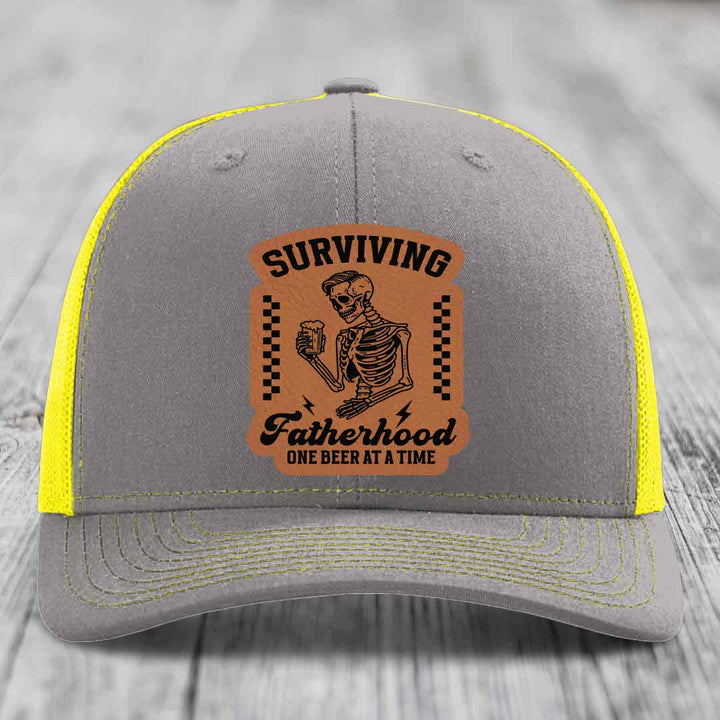 Surviving Fatherhood, One Beer At A Time - Leather Patch Hat - Rawhide to Black Patch - Richardson 112 Snapback Trucker Hat