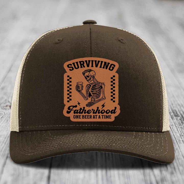 Surviving Fatherhood, One Beer At A Time - Leather Patch Hat - Rawhide to Black Patch - Richardson 112 Snapback Trucker Hat