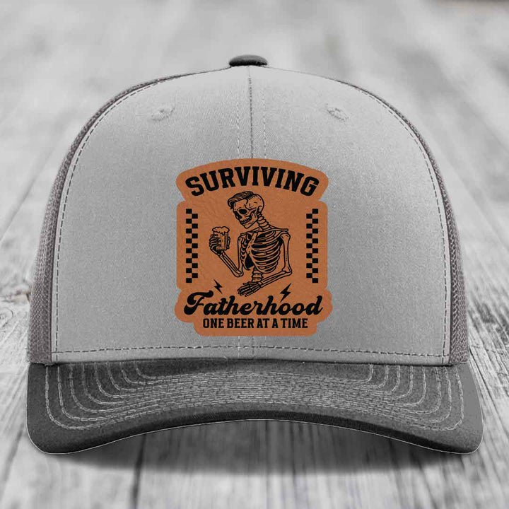 Surviving Fatherhood, One Beer At A Time - Leather Patch Hat - Rawhide to Black Patch - Richardson 112 Snapback Trucker Hat