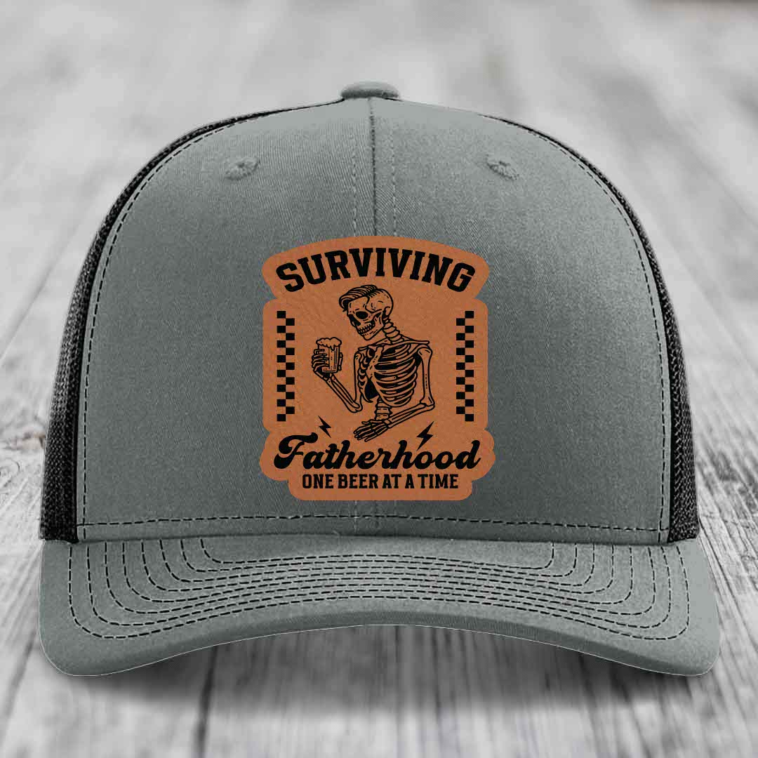 Surviving Fatherhood, One Beer At A Time - Leather Patch Hat - Rawhide to Black Patch - Richardson 112 Snapback Trucker Hat