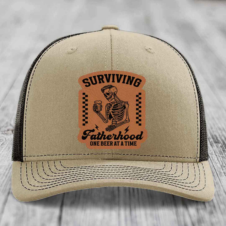 Surviving Fatherhood, One Beer At A Time - Leather Patch Hat - Rawhide to Black Patch - Richardson 112 Snapback Trucker Hat