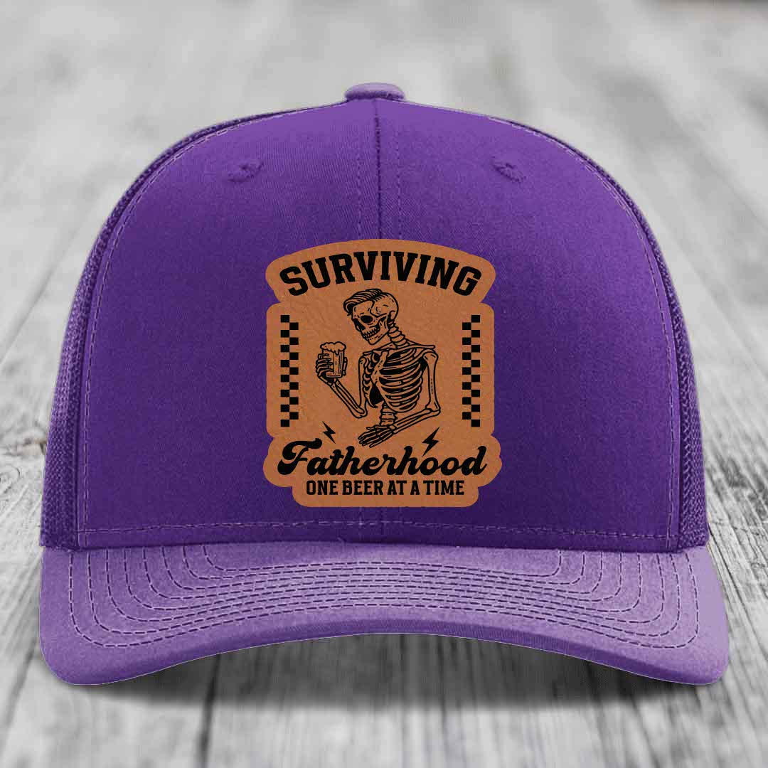 Surviving Fatherhood, One Beer At A Time - Leather Patch Hat - Rawhide to Black Patch - Richardson 112 Snapback Trucker Hat