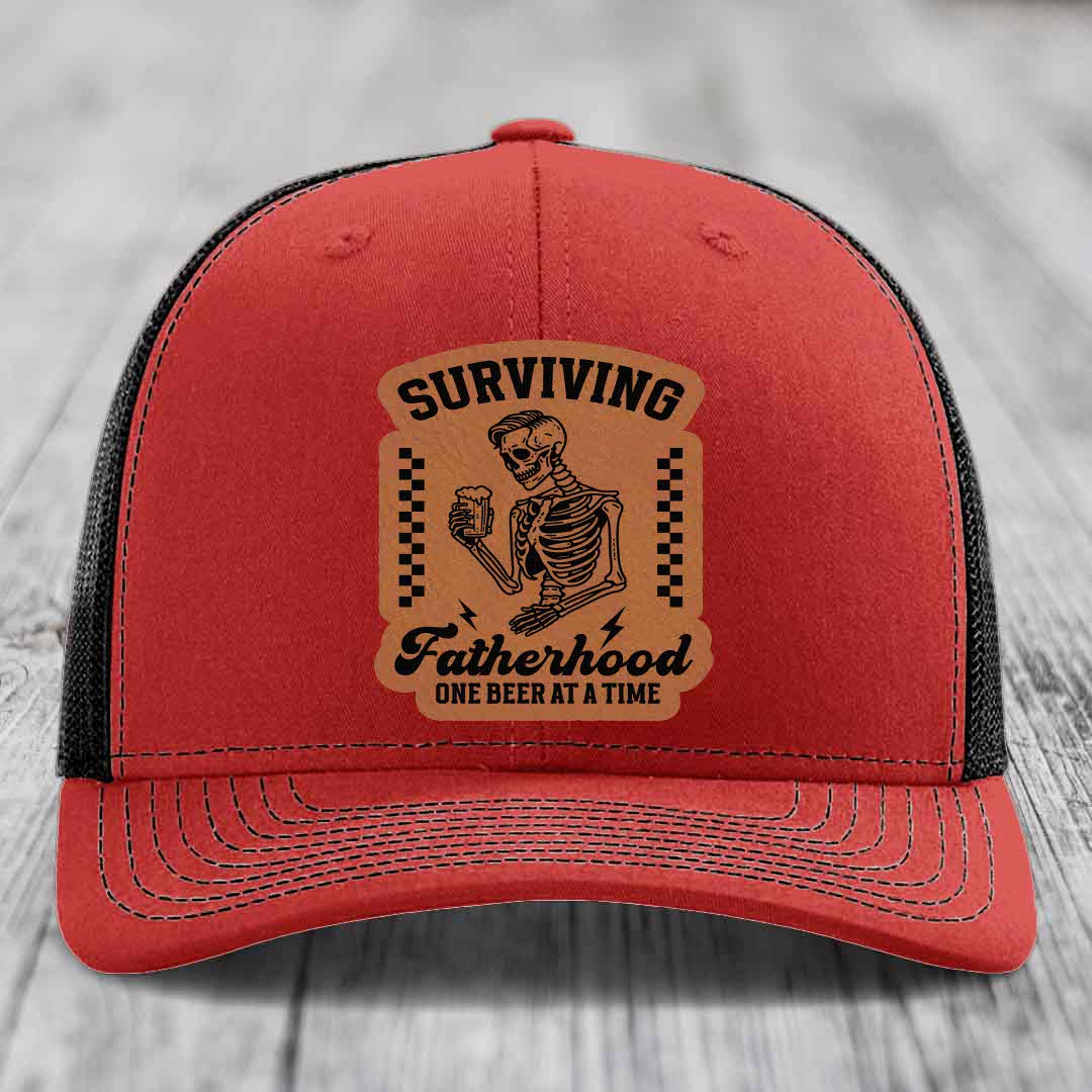 Surviving Fatherhood, One Beer At A Time - Leather Patch Hat - Rawhide to Black Patch - Richardson 112 Snapback Trucker Hat