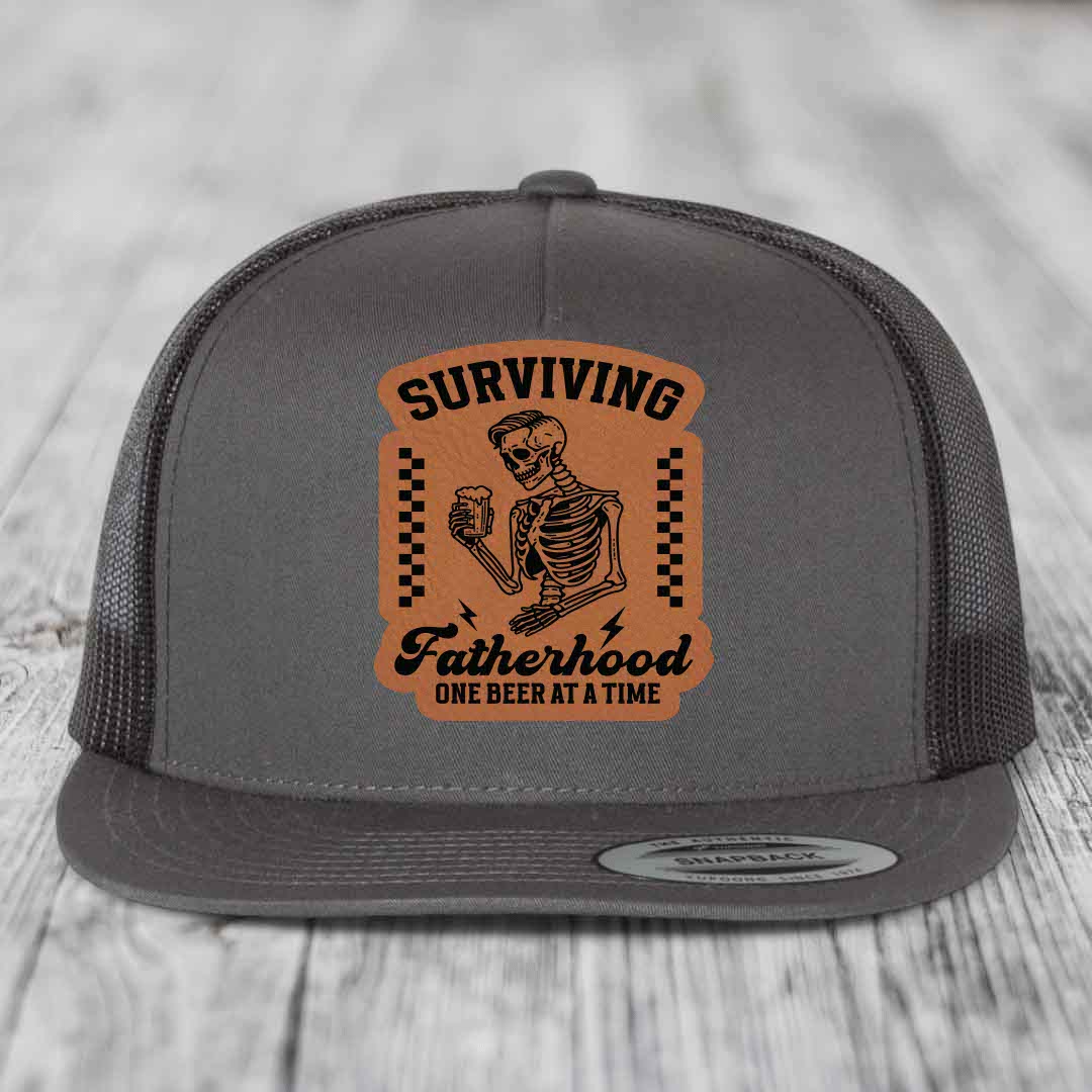 Surviving Fatherhood, One Beer At A Time - Leather Patch Hat - Rawhide to Black Patch - Yupoong 6006 Snapback Flatbill Hat