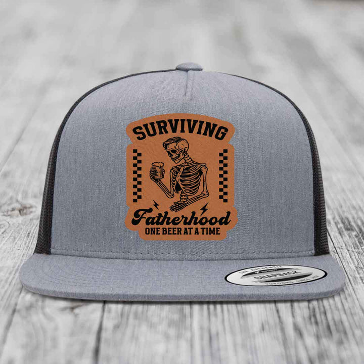 Surviving Fatherhood, One Beer At A Time - Leather Patch Hat - Rawhide to Black Patch - Yupoong 6006 Snapback Flatbill Hat