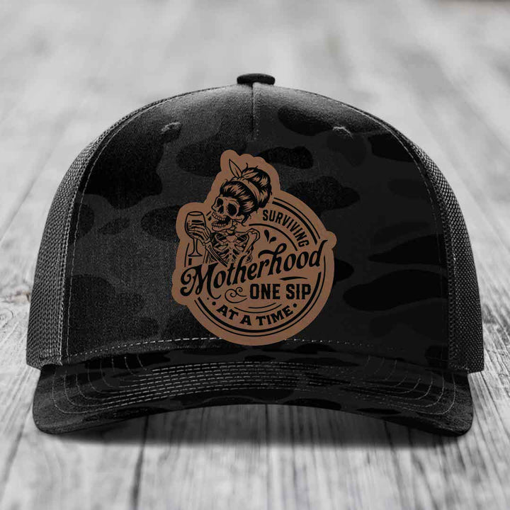 Surviving Motherhood, One Sip At A Time - Leather Patch Hat - Dark Brown to Black Patch - Richardson 112PFP Snapback Trucker Hat