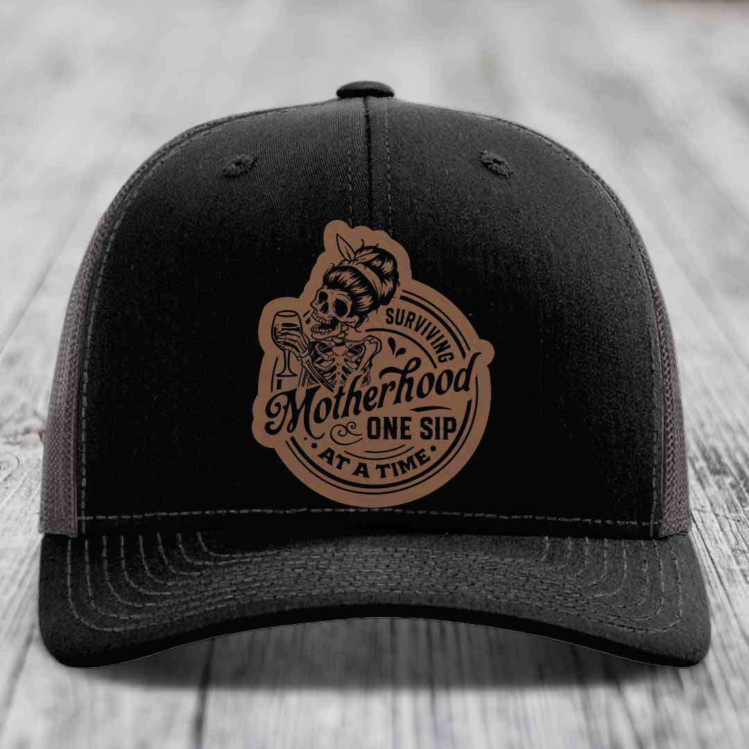 Surviving Motherhood, One Sip At A Time - Leather Patch Hat - Dark Brown to Black Patch - Richardson 112 Snapback Trucker Hat