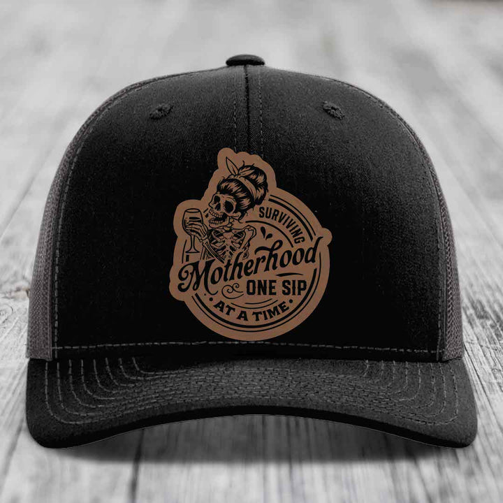 Surviving Motherhood, One Sip At A Time - Leather Patch Hat - Dark Brown to Black Patch - Richardson 112 Snapback Trucker Hat