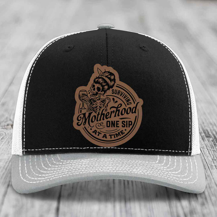 Surviving Motherhood, One Sip At A Time - Leather Patch Hat - Dark Brown to Black Patch - Richardson 112 Snapback Trucker Hat