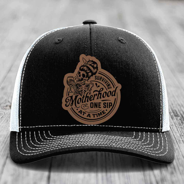 Surviving Motherhood, One Sip At A Time - Leather Patch Hat - Dark Brown to Black Patch - Richardson 112 Snapback Trucker Hat