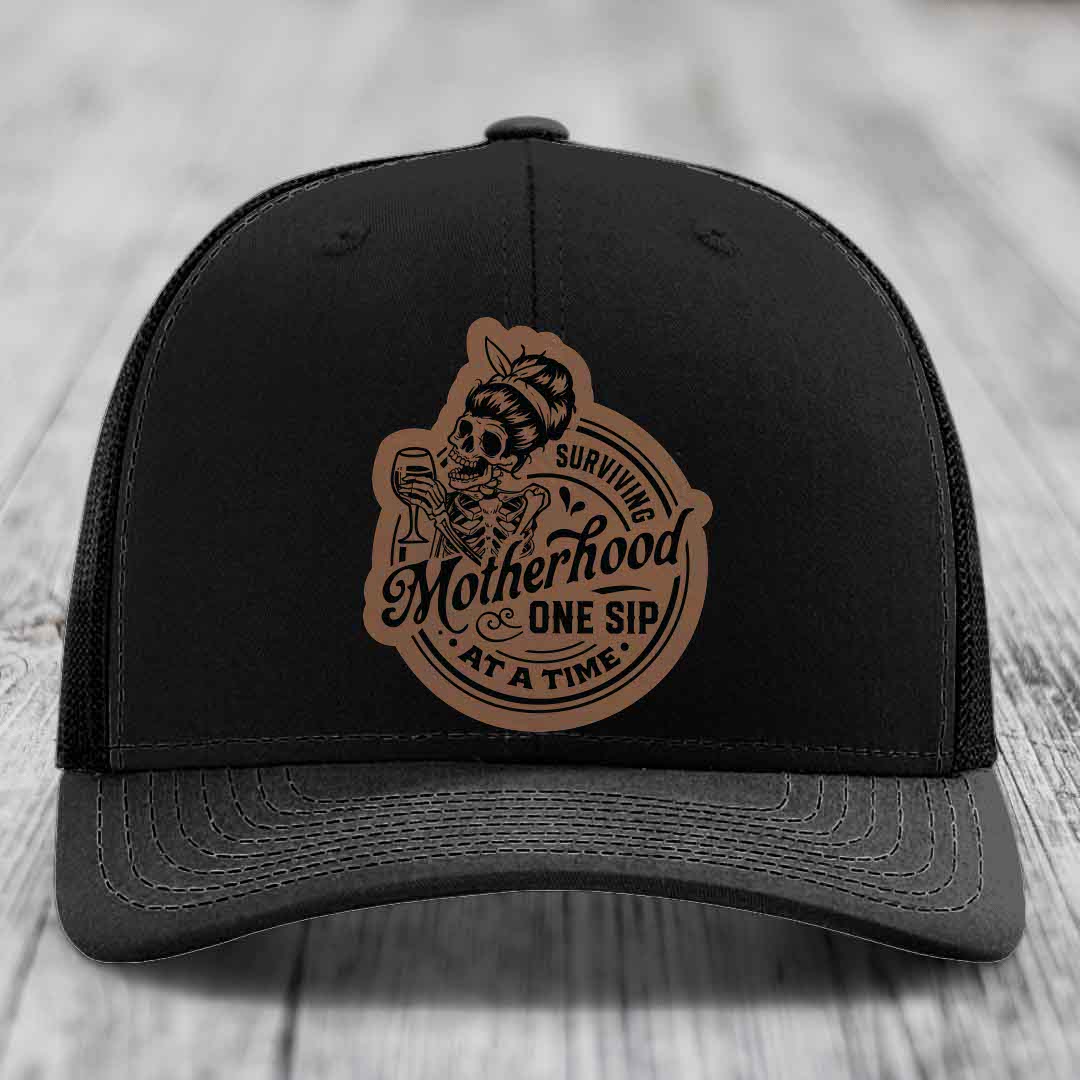 Surviving Motherhood, One Sip At A Time - Leather Patch Hat - Dark Brown to Black Patch - Richardson 112 Snapback Trucker Hat