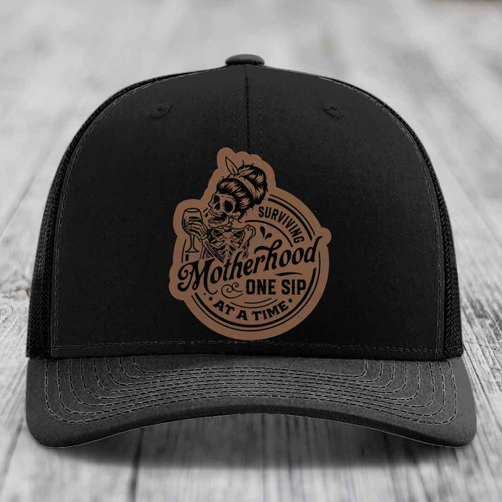 Surviving Motherhood, One Sip At A Time - Leather Patch Hat - Dark Brown to Black Patch - Richardson 112 Snapback Trucker Hat