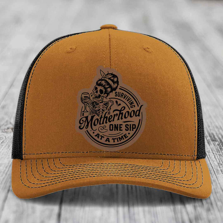 Surviving Motherhood, One Sip At A Time - Leather Patch Hat - Dark Brown to Black Patch - Richardson 112 Snapback Trucker Hat