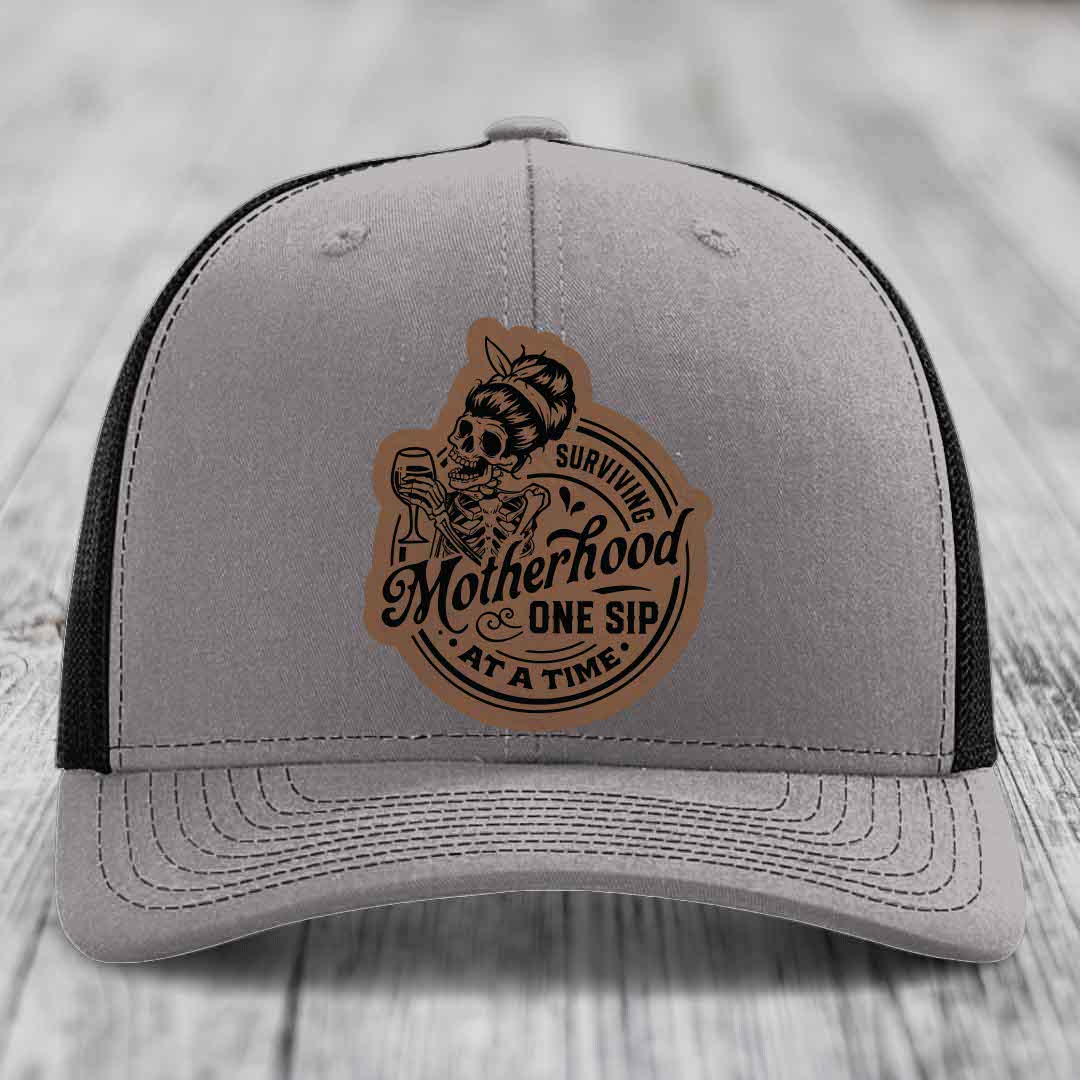 Surviving Motherhood, One Sip At A Time - Leather Patch Hat - Dark Brown to Black Patch - Richardson 112 Snapback Trucker Hat