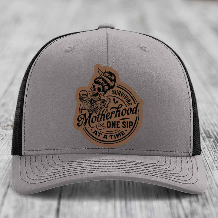 Surviving Motherhood, One Sip At A Time - Leather Patch Hat - Dark Brown to Black Patch - Richardson 112 Snapback Trucker Hat