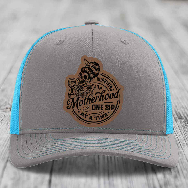 Surviving Motherhood, One Sip At A Time - Leather Patch Hat - Dark Brown to Black Patch - Richardson 112 Snapback Trucker Hat