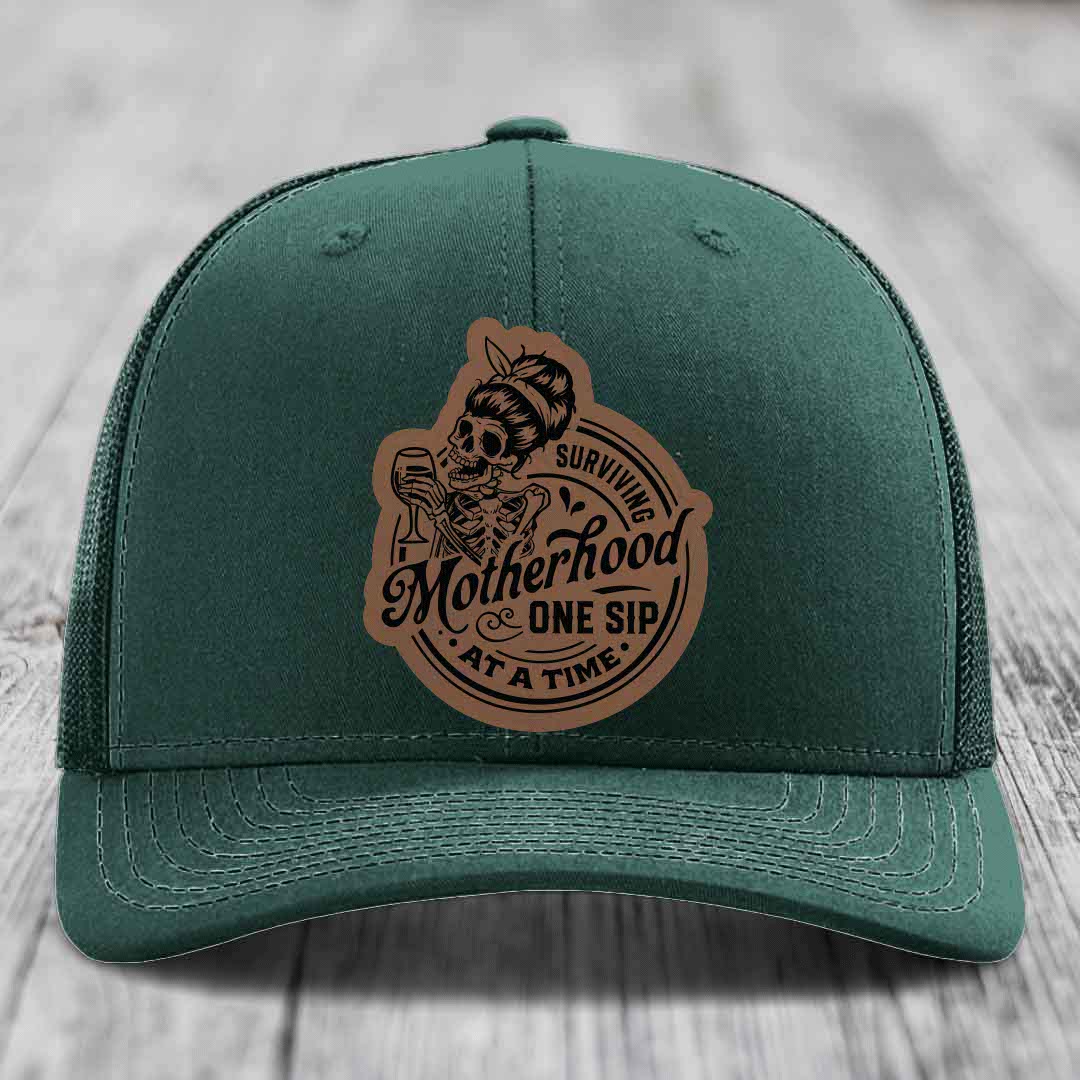 Surviving Motherhood, One Sip At A Time - Leather Patch Hat - Dark Brown to Black Patch - Richardson 112 Snapback Trucker Hat