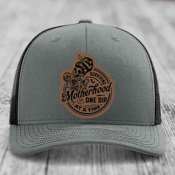 Surviving Motherhood, One Sip At A Time - Leather Patch Hat - Dark Brown to Black Patch - Richardson 112 Snapback Trucker Hat
