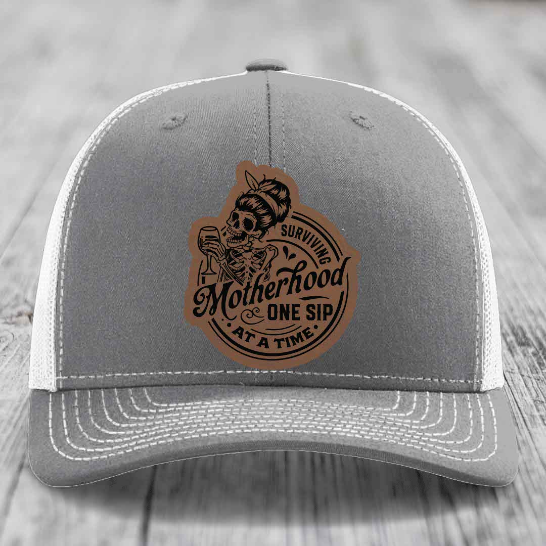 Surviving Motherhood, One Sip At A Time - Leather Patch Hat - Dark Brown to Black Patch - Richardson 112 Snapback Trucker Hat
